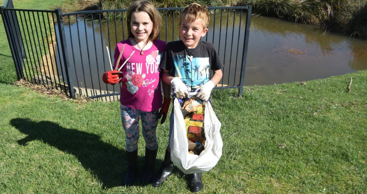 ACTION: Molly, 8, and brother Owen, 6, collected this rubbish (with some help from mum and dad!) in just 15 minutes at Delroy Park on Monday - despite the fact they'd spent hours cleaning up the day before. Photo: JENNIFER HOAR