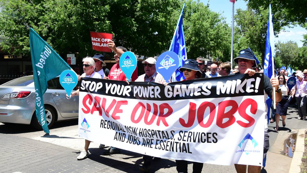 Workers, community members and trade unionists gather outside the Dubbo RSL Memorial Club ahead of their march along Brisbane and Macquarie Streets. It was followed by a rallying in sweltering conditions at the Church Street rotunda. Photos: BELINDA SOOLE