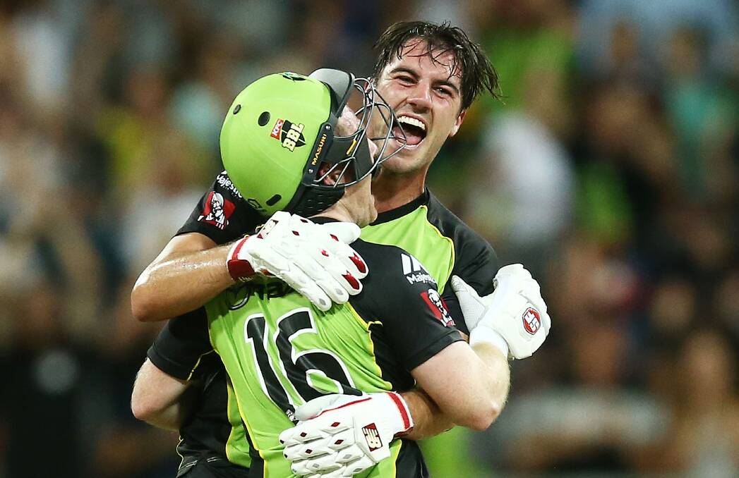 Thunderstruck: Pat Cummins (right) and Thunder teammate Eoin Morgan celebrate victory over the Melbourne Stars earlier this month. Photo: GETTY IMAGES
