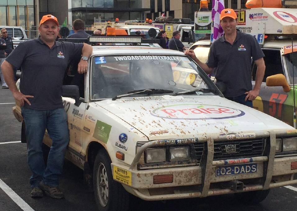 Rallying support: David Ward and long-time friend Derek Blomfield with Errol the 1992 Subaru Brumby ute at the Kidzfix Rally finish line in Bendigo. Photo: TWO DADS