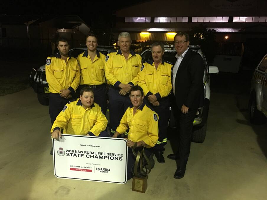 STATE CHAMPIONS: Members of the RFS Orana Composite Team, which won the 2016 NSW RFS State Championships, with Dubbo MP Troy Grant.