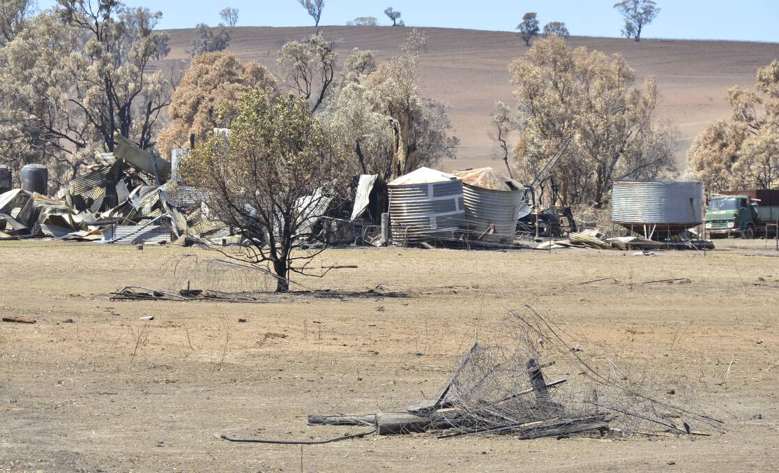 DAMAGE TOLL RISING: The remnants of fencing can be seen strewn across the ground at this property between Uarbry and Dunedoo. Photo: BELINDA SOOLE