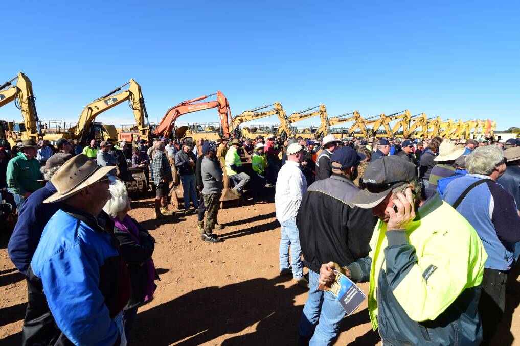 GOING ONCE, TWICE, SOLD: Thousands of visitors and locals gathered at the Pilons Drive site for Wednesday's auction. Photo: BELINDA SOOLE