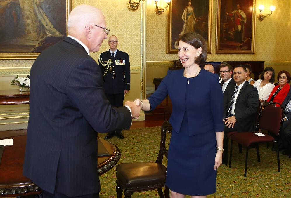 New leadership: Gladys Berejiklian is sworn in as NSW Premier by Governor David Hurley at Government House. Photo: GETTY IMAGES