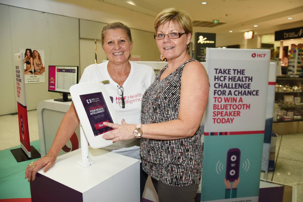 KNOW YOUR HEALTH: Dubbo branch manager Dale Wykes helps Chris Darcy take the HCF Health Challenge. The chalenge is open until March 31. Photo: BELINDA SOOLE