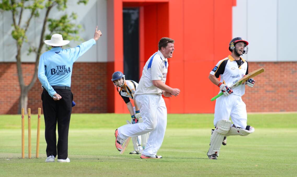 HE'S OUT: Luke Carmen rushes to celebrate the wicket of Jordan Peacock in Macquarie's win over Newtown. Photo: PAIGE WILLIAMS