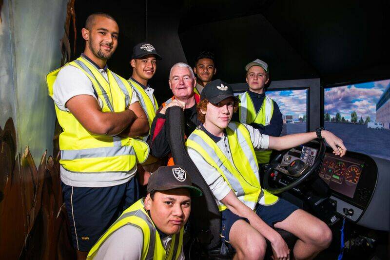 Taking the wheel: Students from St Andrew’s College at the simulator controls with TAFE Western Teacher Ray Driscoll. Photo: CONTRIBUTED
