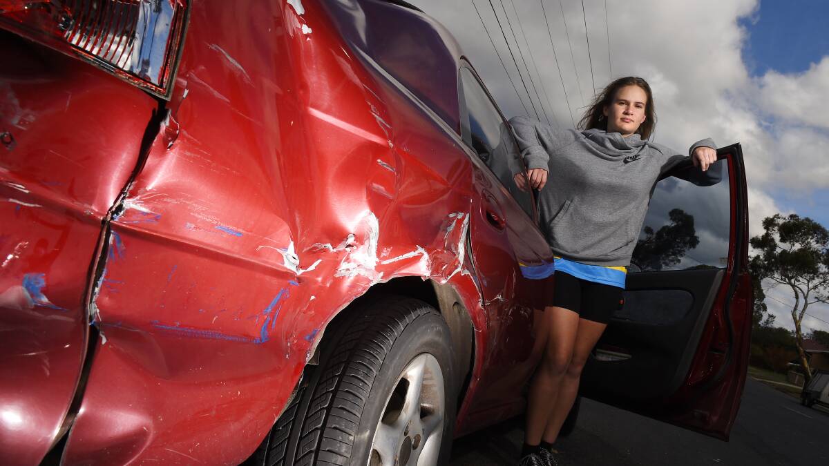 Enough is enough: Natasha Thomas, 19, is concerned for the safety of residents on Magpie Street after hoons smashed into her car on Thursday morning. Picture: Luka Kauzlaric