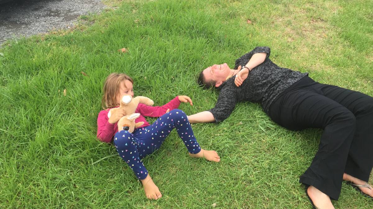 Que Langdon and Ariane Wyler play in the grass following their reunion on Sunday. Image: supplied. 