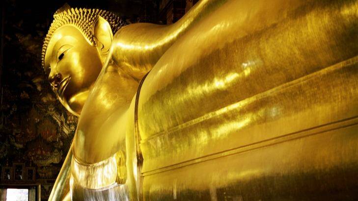 Wat Pho temple and the reclining Buddha in Bangkok, Thailand.



Reclining Buddha, Wat Po, Bangkok, Thailand