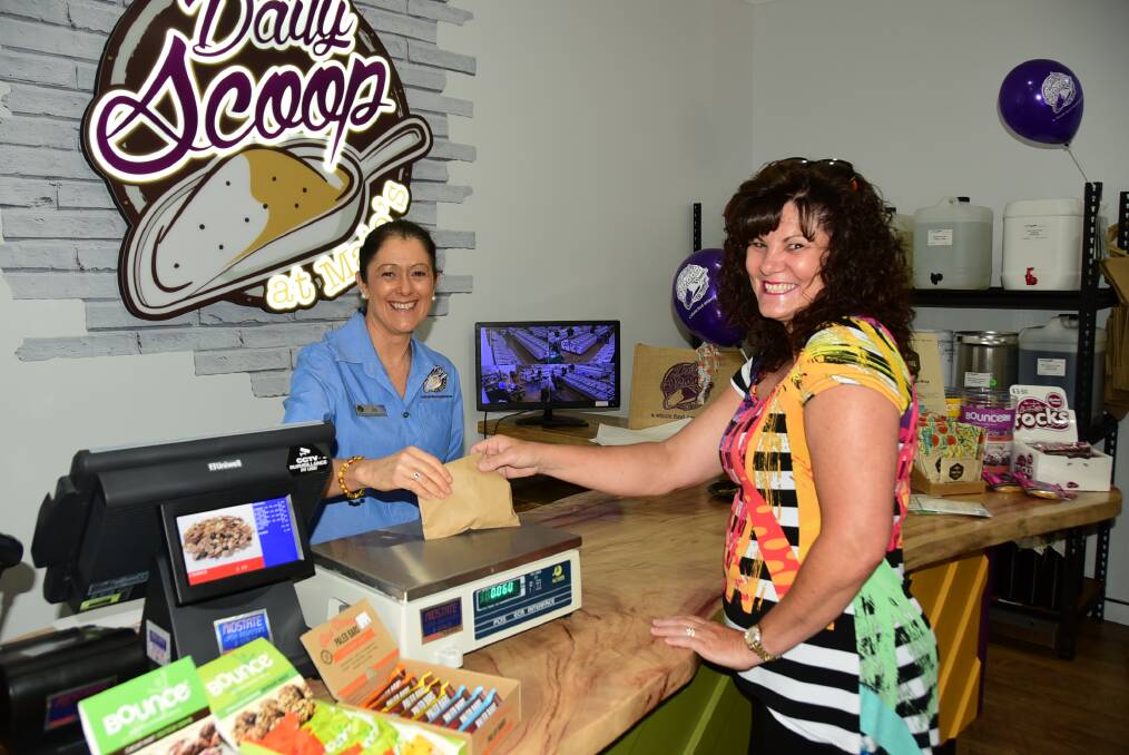 Jo Campbell serves Karen McGuire during the grand opening of Daily Scoop at Majo's. Photo: CHERYL BOURKE