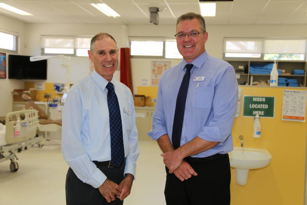 TAFE Western manager of educational programs Michael Bourke discusses the new mental health course with the Western NSW Local Health District s director of mental health, drug and alcohol services Jason Crisp. 
Photo: CONTRIBUTED