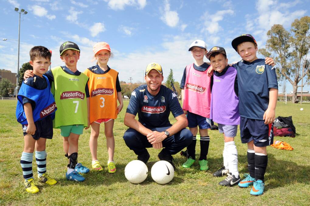 Some of the young soccer stars who took part in the clinic at Ollie Robbins Oval were Lochie Murphy, Seb Low, Mia Penman, Mariners Community Development Officer Adam Kwasnik, Max Bourke, Jerrell McMillan and Jacko Brightman.  
													  Photo: BELINDA SOOLE