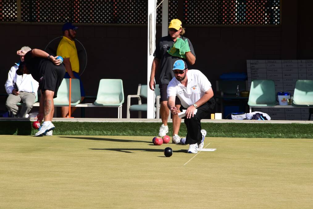 Jay Porter on the mat during yesterday's semi-final win in the Masters Pairs at Railway Bowling Club. Photo: BELINDA SOOLE