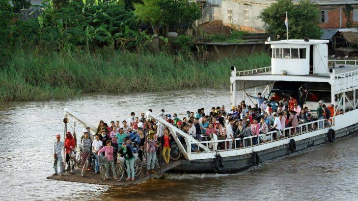 Cross-river ferry on the Mekong north of Phnom Penh.
 Photo: Brian Johnston