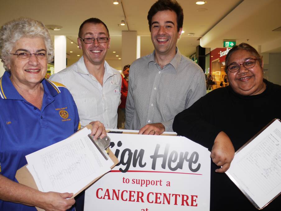 The federal government s $25 million election commitment to an integrated cancer centre at Dubbo Hospital puts smiles on the faces of community campaigners collecting signatures for a petition in support of the facility at Dubbo Square on Friday. They are (from left) Rotary Club of Dubbo West s Lyn Smith, nurse unit manager of oncology at Dubbo Hospital Tim Williams, Dubbo-based oncologist Dr Florian Honeyball and the campaign s social media architect Franny Peters-Little. 							     Photo: KIM BARTLEY