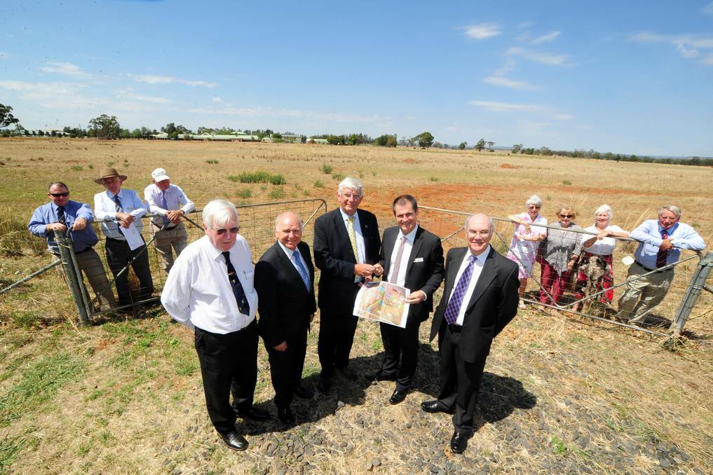 (Front) Leon Burke, Royal Freemasons' Benevolent Institution (RFBI) director David Adams, RFBI CEO Alex Shaw, Dubbo mayor Mathew Dickerson and Dubbo City Council's David Dwyer at the exchange of contracts for the Keswick land, watched on by Mark Dan, Derek Wetton, Col Francis, Natalie Burke, Joy Austin, Diana Browne and David Lander. File photo.