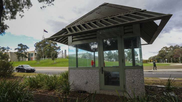 Four unused security guardhouses on the perimeter of Parliament House are unkept and dirty. Photo: Graham Tidy