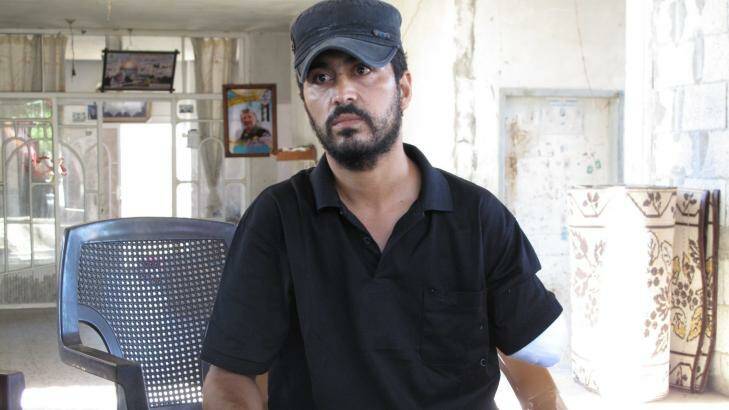 Nabil Siyam, 33, lost his left arm in the attack on July 21 in which his wife and four children were killed. A fifth child is dangerously ill in hospital. Photo: Ruth Pollard