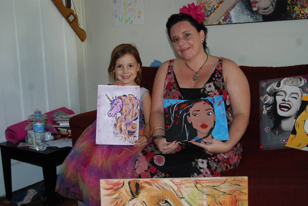 Sacha Whitehead and her daughter Halli with some of the artworks Sacha has painted to raise money for Parkinson s disease research.	 Photo: GRACE RYAN