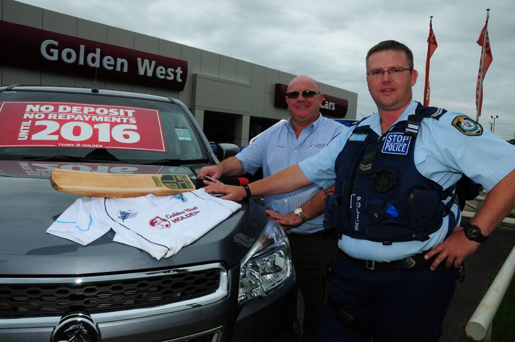 Golden West Holden's Michael Adams, one of the sponsors of the NSW police team, and Senior Constable Luke Trudgett who will be travelling to the Australia New Zealand Police Cricket Championship (ANZPCC) next month. 						Photo: BELINDA SOOLE