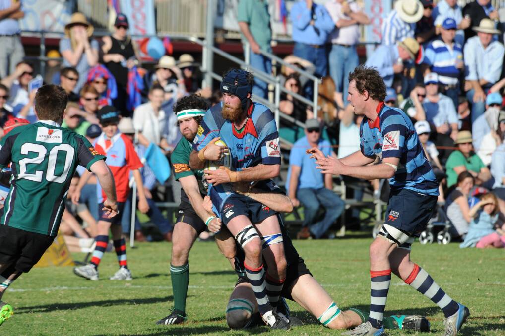 Shaun McHugh crashes the ball into the heart of the Emus defence during Saturday's grand final. 			       Photo: BELINDA SOOLE