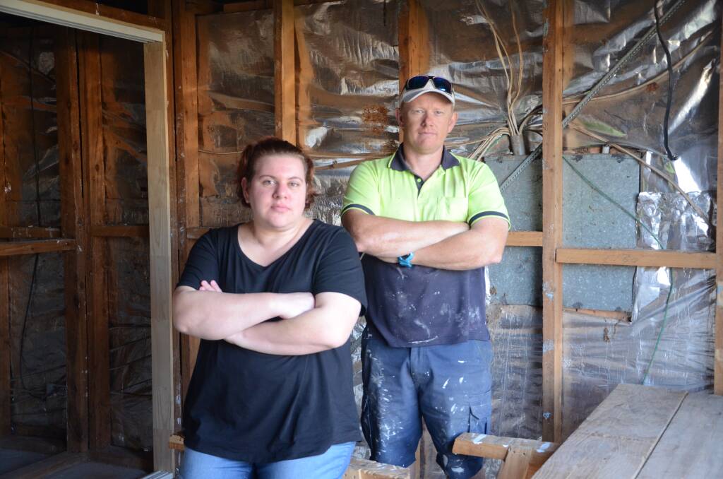 Melissa Stevens and her uncle Shaun McDougall at the home, which is currently being renovated so the family can return home. 				 Photo: JENNIFER HOAR