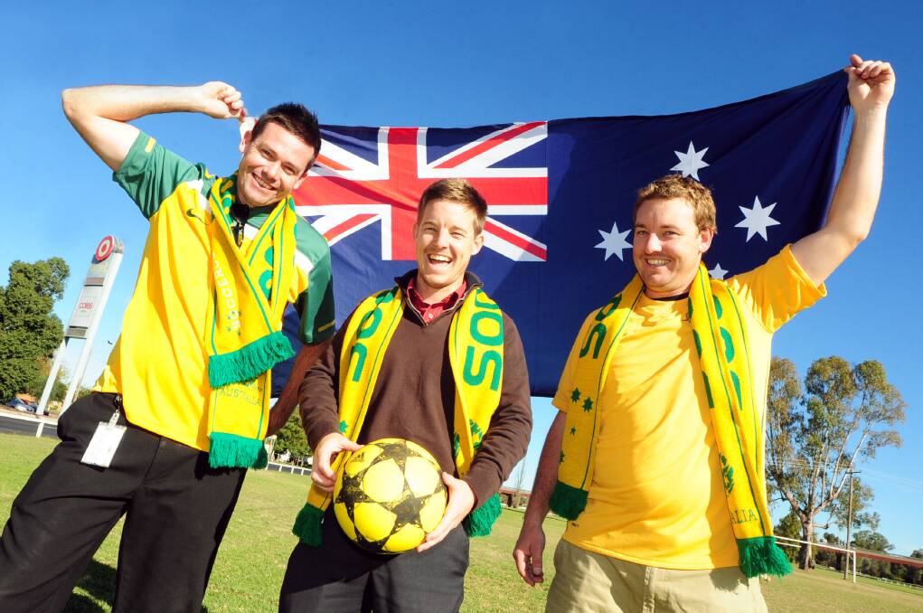 Alan Auld, Rhys and Leigh Osborne of Macquarie United Football Club gear up for the World Cup.