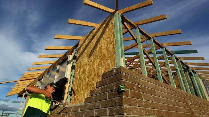 A bricklayer at work in Middleton Grange, where more than 2500 new homes are expected to be built. Photo: Kate Geraghty