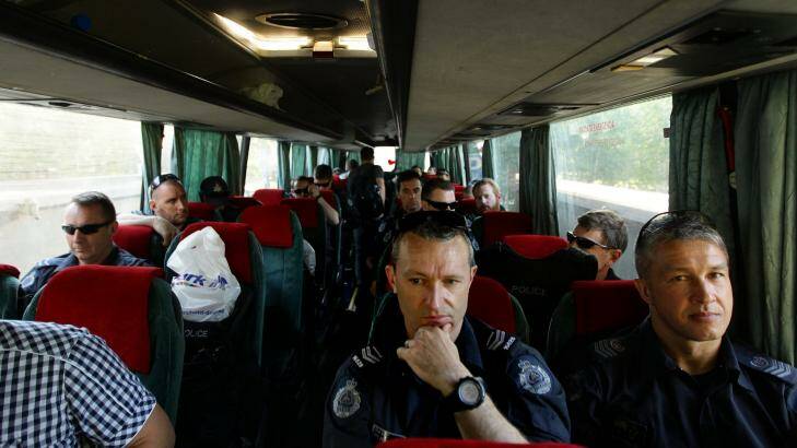 AFP officers on a bus head to Soledar village. Photo: Kate Geraghty