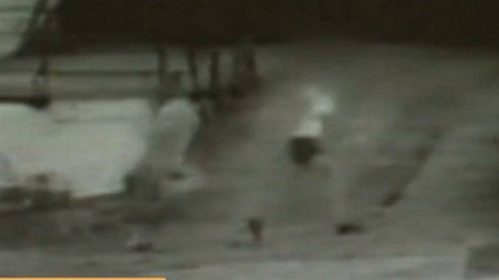 The grainy CCTV vision showed the woman running from the attack.  Photo: Channel Nine