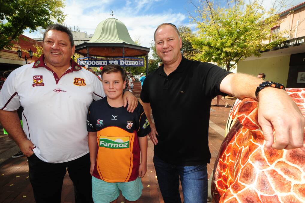 Dubbo rugby league fan Harley Smith (centre) with Country assistant coach Steve Roach and City team manager Paul Sironen in Dubbo. 			Photo: BELINDA SOOLE