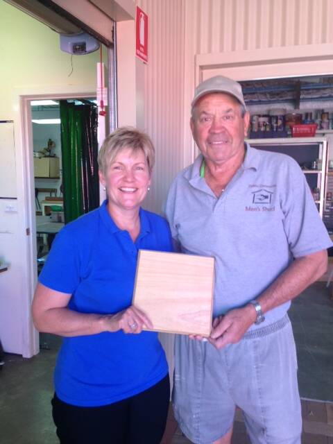 Dubbo Make A Wish secretary Sharyn Hunter and Dubbo Community Men's Shed president Phil Knight with the wooden platters that will be sold after the lunch. Photo: CONTRIBUTED