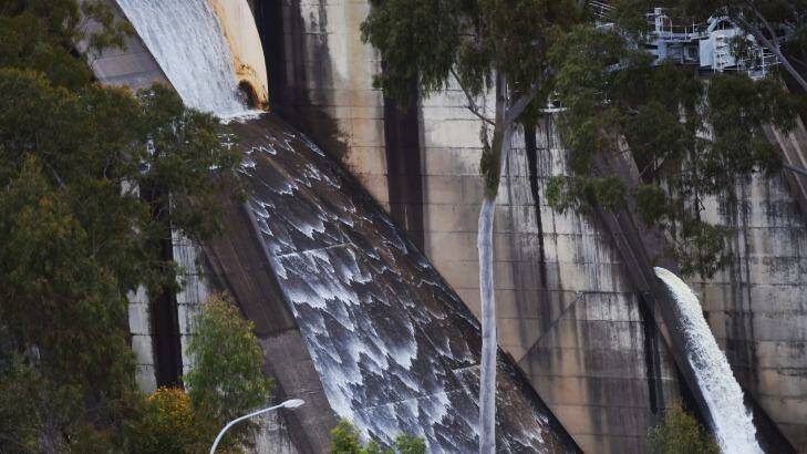 Water flows over the Warragamba Dam spillway on Thursday. Photo: Nick Moir