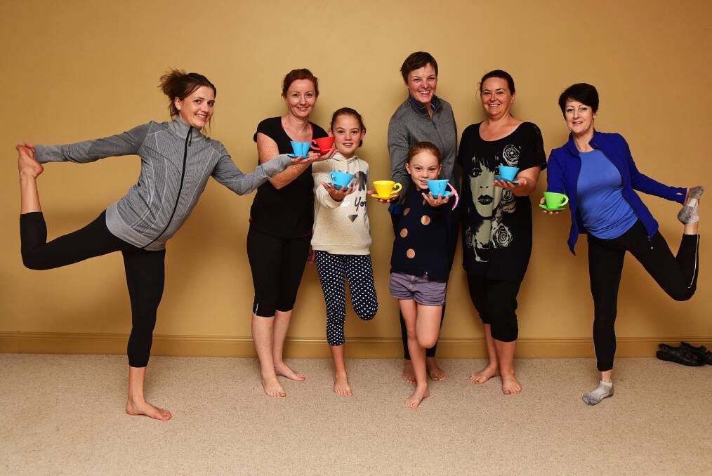 Yoga teacher Sylvia Dashwood with class participants Lesa Towart, Molly Quilty, Jemima Quilty, Amy Quilty, Melissa Gray and Pamela Dickerson. 
 Photo: BROOK KELLEHEAR-SMITH