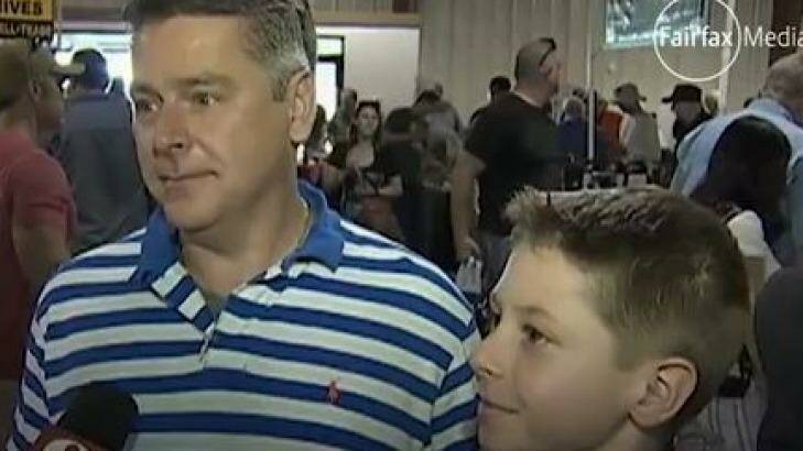 Father and son attend the gun show in Orlando looking to protect themselves. Photo: Screegrab