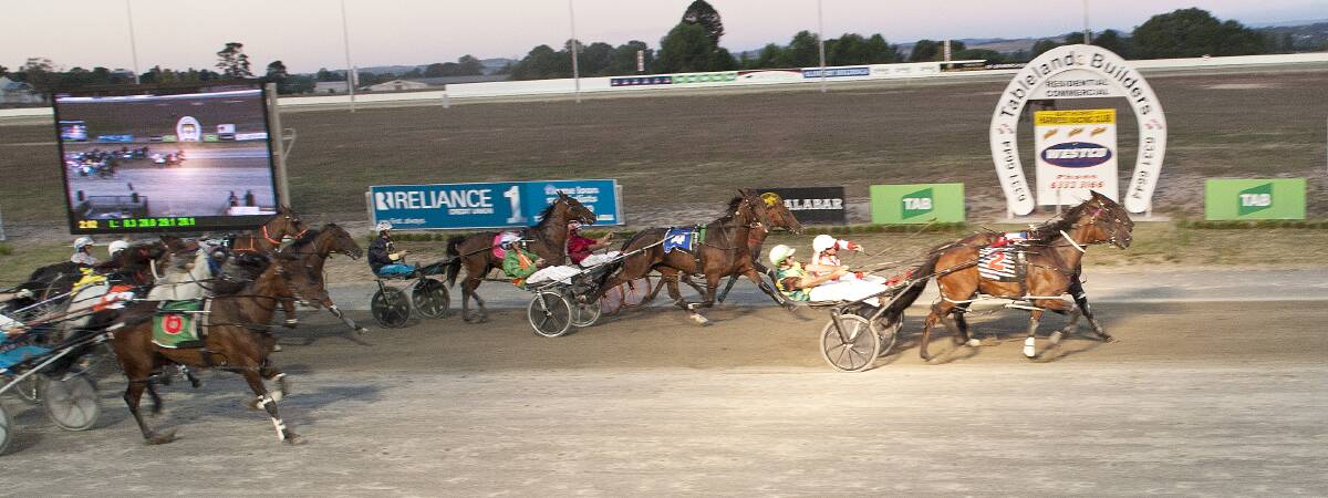 The Brad Hewitt trained and driven Tullow (#2) holds off Saloon Passage in a tight finish to the GJ and AD Turnbull Cathedral Parish Cup on Friday night. 	Photo: CLARE LEWIS