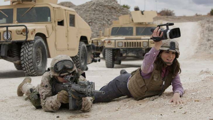 Tina Fey, right, as war correspondent Kim Baker. Photo: Paramount