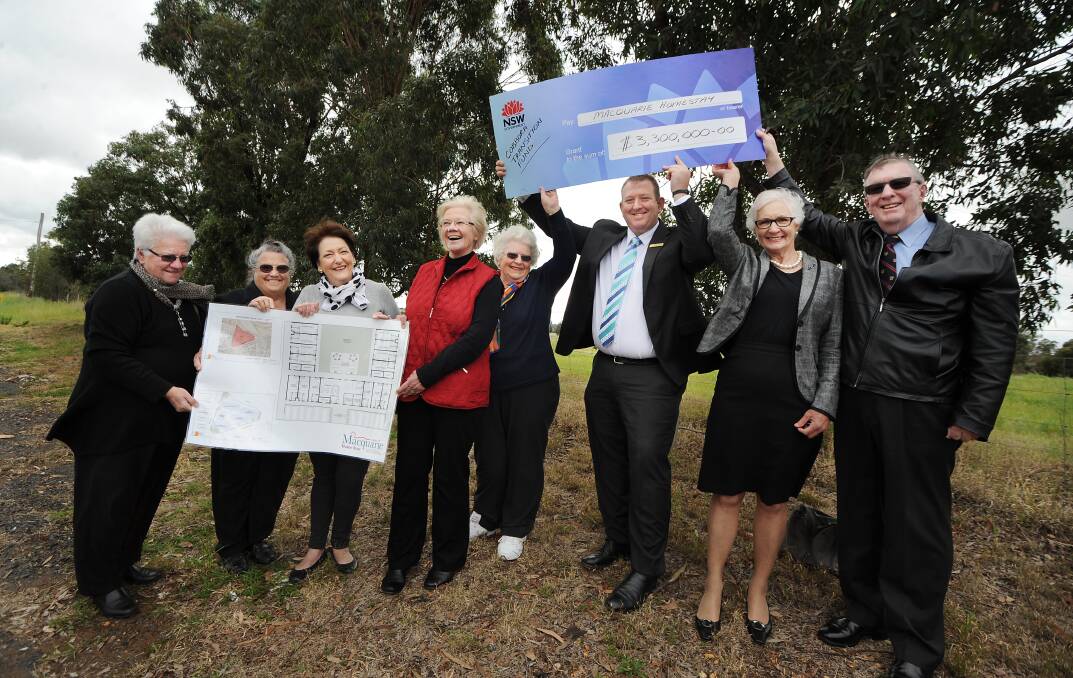 Supporters of Macquarie Homestay, including Lorna White, Dot Martin, Nola Honeysett, Fiona Prentice, Elizabeth Allen, chairman Rod Crowfoot, Dawn Collins and Ray Nolan celebrate the $3.3 million government grant that will allow them to start construction.          	       Photo: BELINDA SOOLE