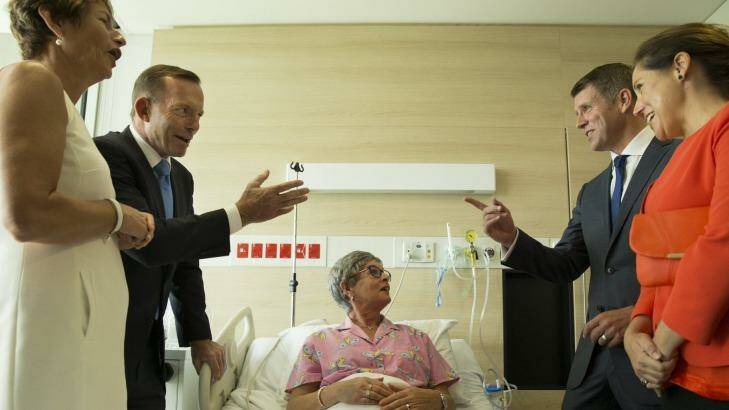 Mike Baird,  right, with his wife Kerryn and Tony Abbott, left, with his wife Margie visit breast cancer patient Lyn Marvey at the Chris O'Brien Lifehouse Hospital. Photo: Nic Walker