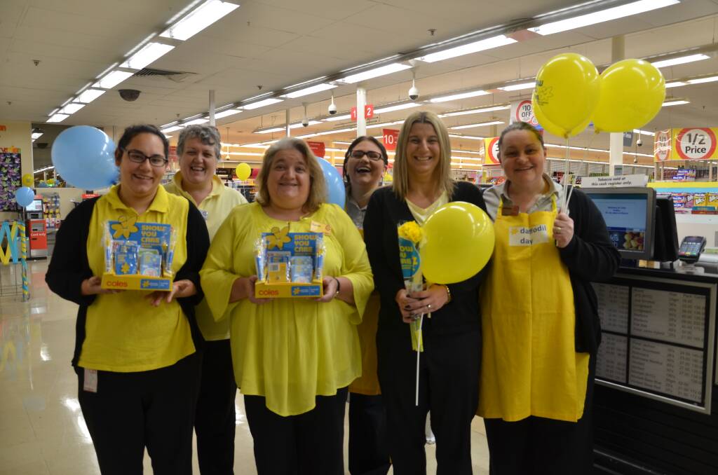 Coles Dubbo Square staff Kim Warman, Brittany Hill, Grace Brown, Sharon Cusack, Julie McDougall and Kathryn Thorne embraced Daffodil Day in aid of Cancer Council Australia. Photo: JENNIFER HOAR