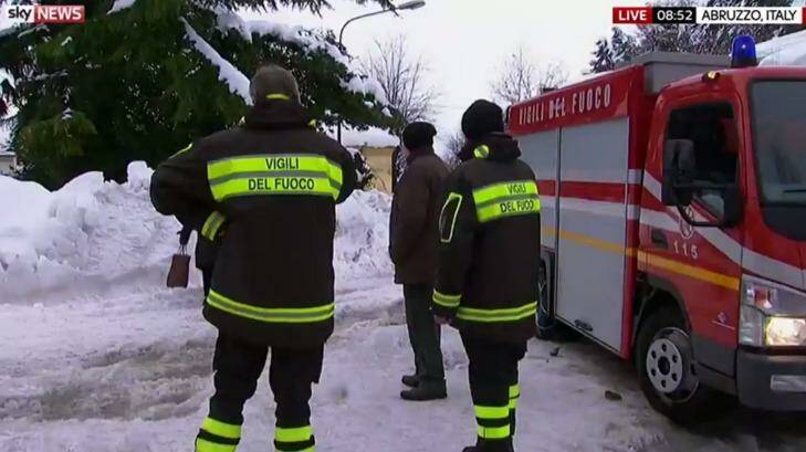 Rescuers wait next to a fire truck in Abruzzo on Thursday morning. Photo: Sky News