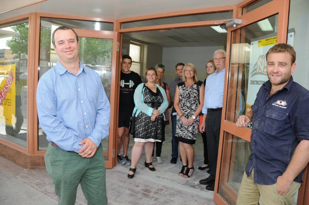 Headspace Consortia members Murray Kruger, Amie Carrington, Gaye Walker, Bryan Hoolahan, Kylie Byrnes, Rowena McCauley, Peter Wenham and (front) Headspace operations manager Peter Rohr and NJK Constructions project manager Nathan Kelleher at the new Headspace office in Dubbo. 	Photo: BELINDA SOOLE