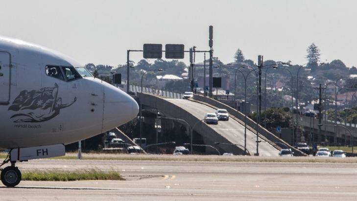 Separate motorway links are planned from Sydney Airport's domestic and international terminals to the WestConnex tollroad. Photo: Cole Bennetts