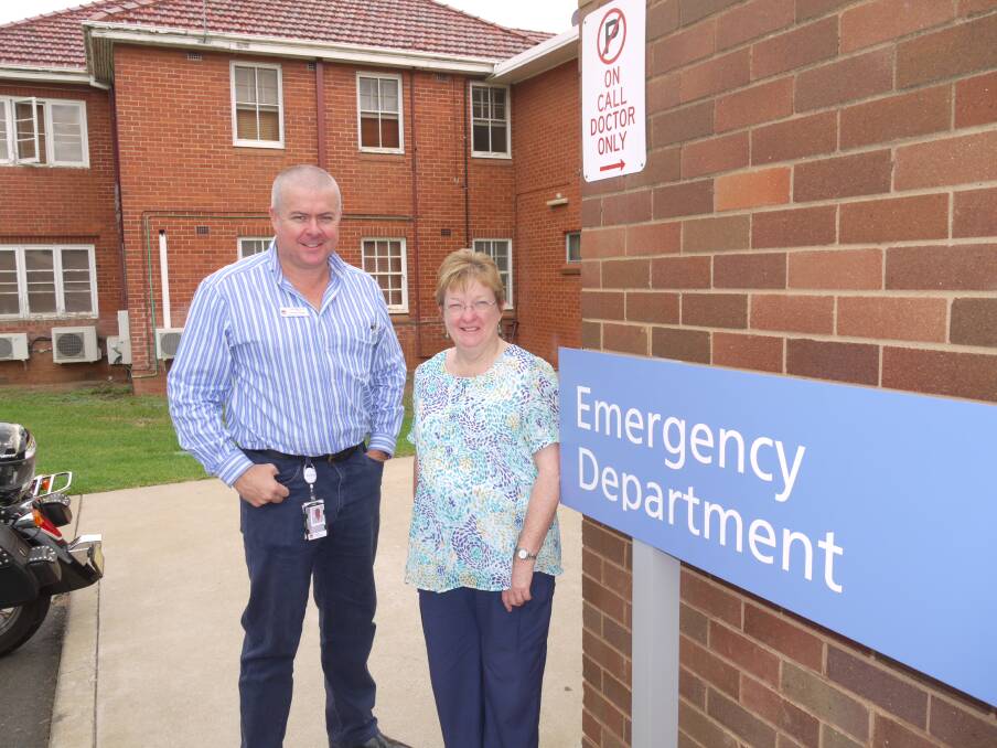 Dubbo Hospital Emergency Department operations manager Clint Grose confers with president of the Rotary Club of Dubbo Jeannette Miller on its bid to raise $20,000 to buy new ultrasound equipment for the department.                                                   Photo: KIM BARTLEY