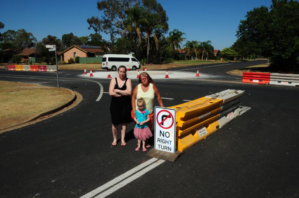Rebecca Boehme, Annette Webber and (front) Mathilda Boehme at the Baird Drive roundabout, for which there has been a revised concept plan. File photo.