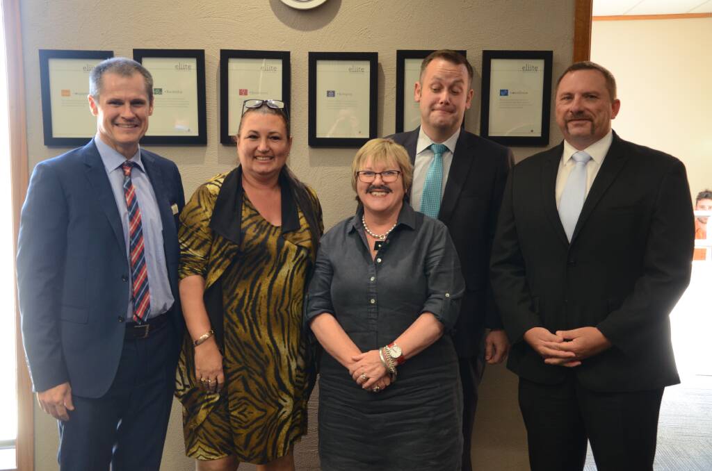 Showing off their support for Movember at Monday's council meeting were Dubbo mayor Mathew Dickerson, Tina Reynolds, Lyn Griffiths, Ben Shields and Greg Mohr.  
										        Photo: ORLANDER RUMING