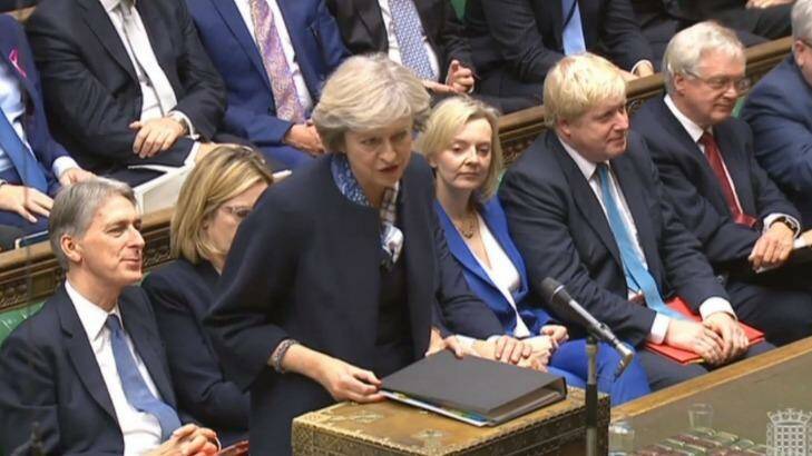 Britain's Prime Minister Theresa May, centre, stands to answer a question during Prime Minister's question time in the Commons. Photo: PA