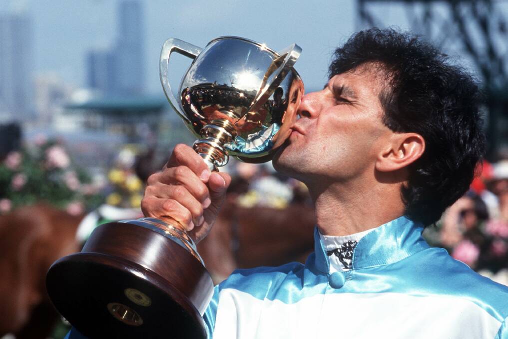 Jockey John Marshall, seen here celebrating his 1999 Melbourne Cup win aboard Rogan Josh, will be in Gilgandra on Friday and Saturday as the 2015 cup tour visits the central west.  
Photo: GETTY IMAGES
