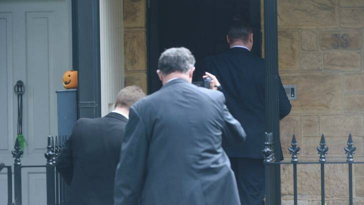 Wayne Beavis' house as it is raided. Photo: Nick Moir